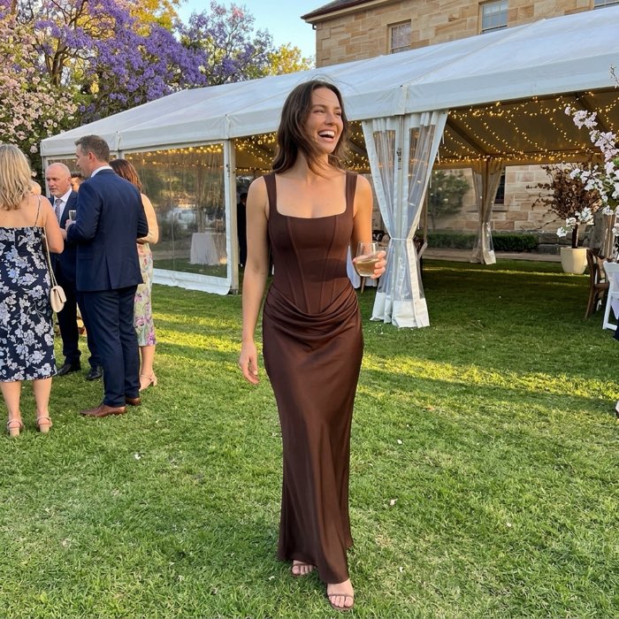 Woman in a long evening dress at a spring wedding